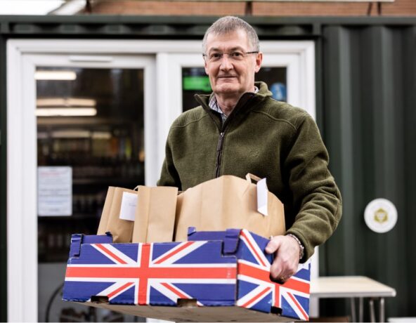Man carrying a crate of supplies