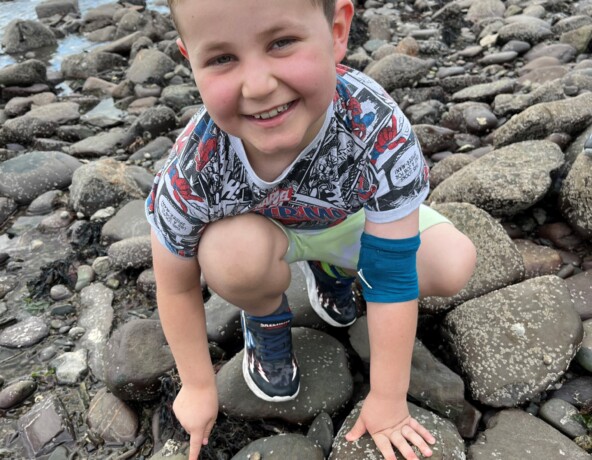 Young child beach combing
