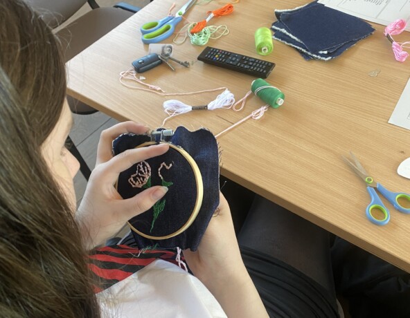Girl embroidering flowers